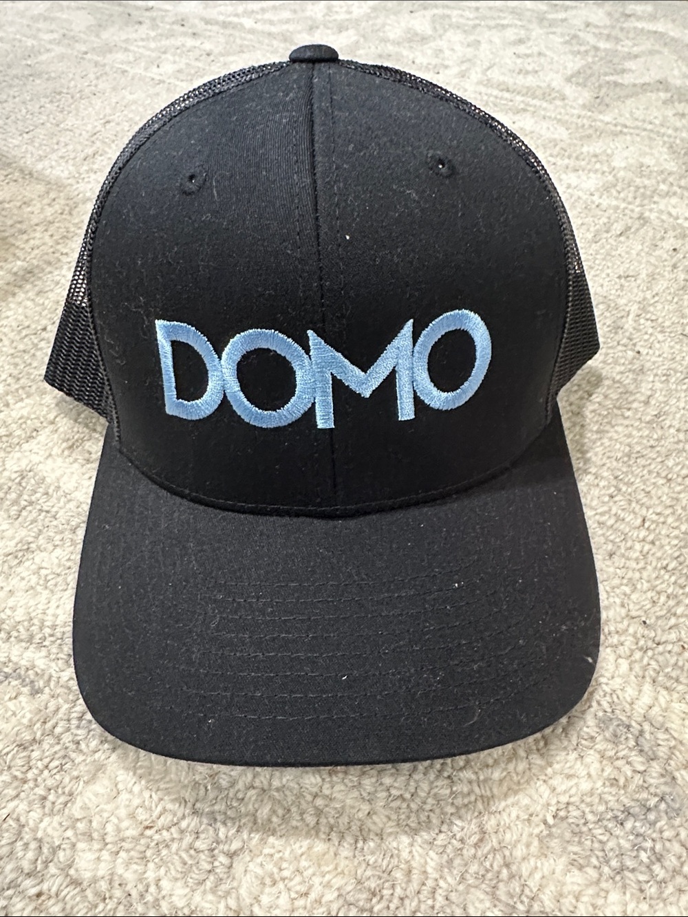 The Classic Black Trucker Hat with Light Blue DOMO Logo (23)